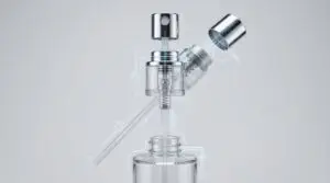 Technical diagram and 3D rendering of a cosmetic spray bottle mechanism for blog banner